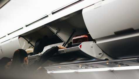 What Should You Do If a Plane Passenger Puts a Suitcase in Your Overhead Bin? Here’s What Flight Attendants Say